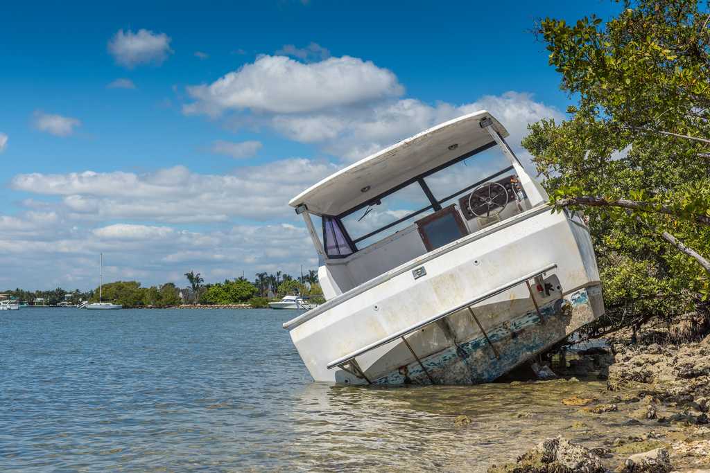 Abandoned and damaged boat in need of insurance 